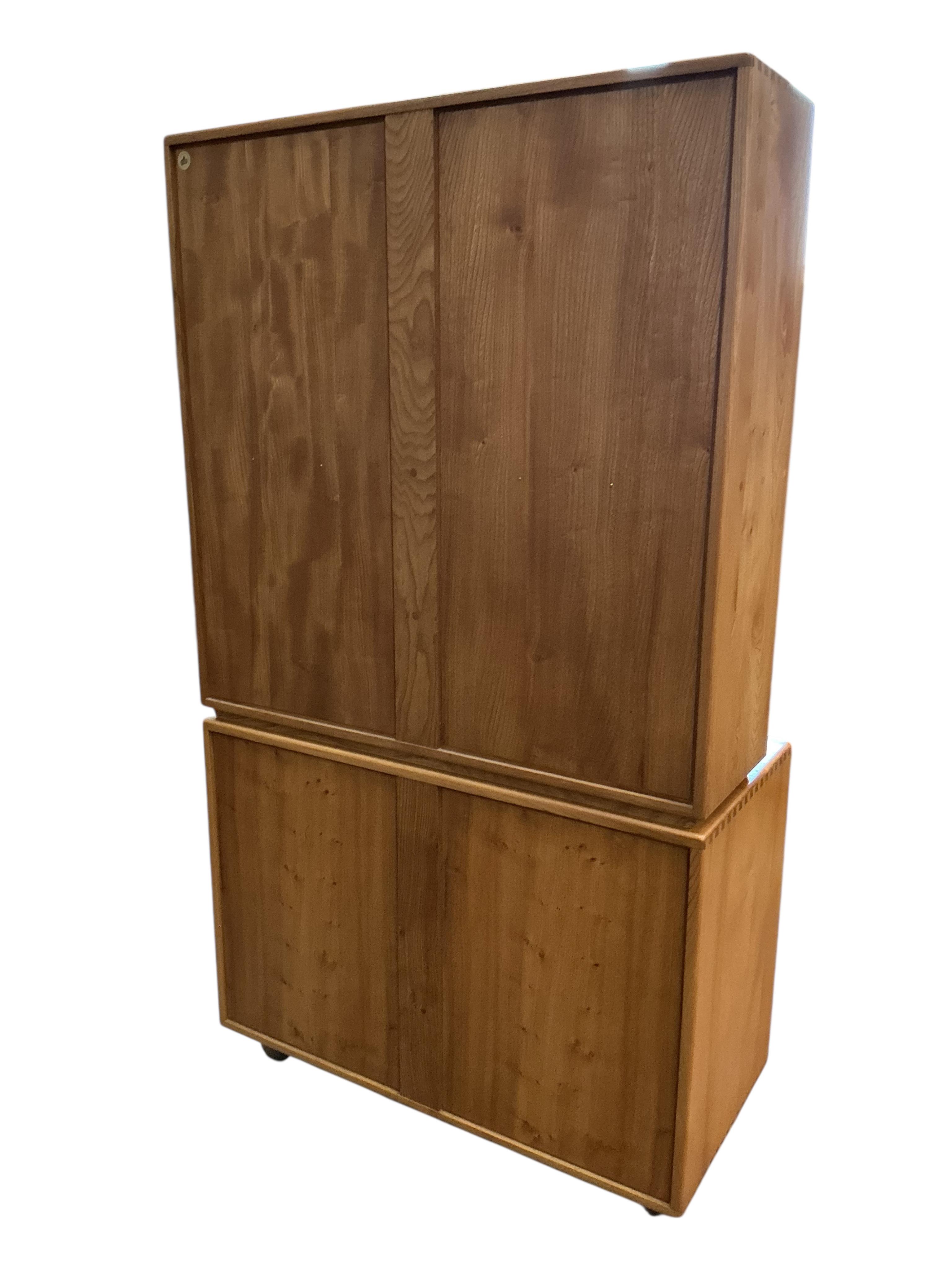 An Ercol Windsor light elm writing cabinet, width 91cm, depth 45cm, height 163cm